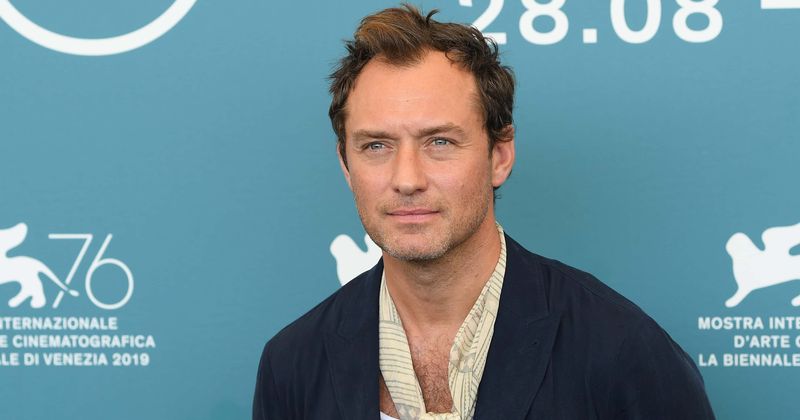 Jude Law stuns in tiny white speedo as he takes a dip at Venice beach during filming of 'The New Pope'