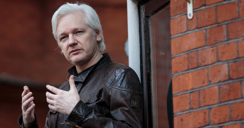 What are the potential charges against Julian Assange following his arrest in London?