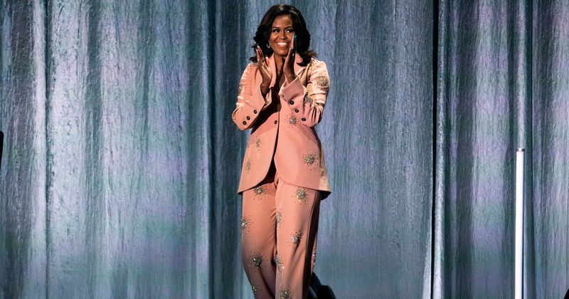 Michelle Obama rocks a $2,300 crystal-embellished pink suit while promoting her book 'Becoming' in Copenhagen