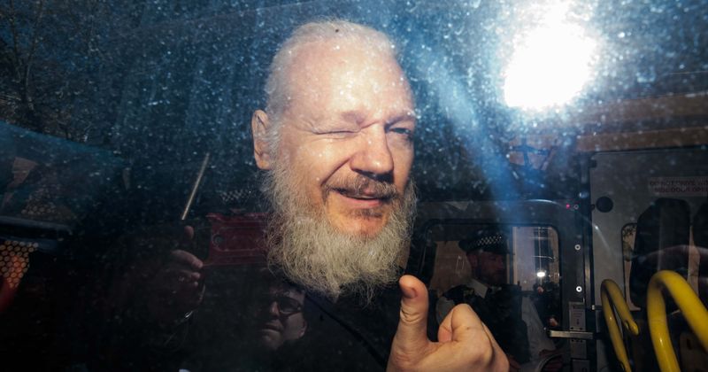 Julian Assange kicked out of embassy for leaking photo of president eating a lobster in bed, claims report