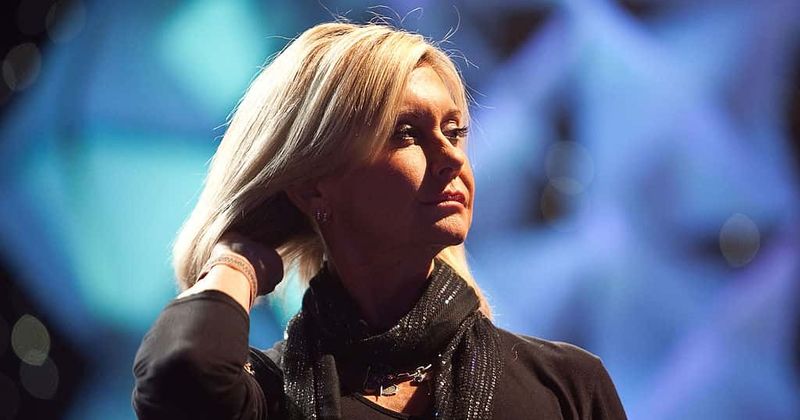 Olivia Newton-John slams rumors about her health, says she's 'doing great' as she battles cancer a third time