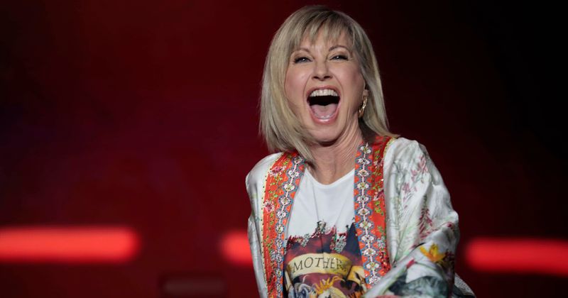 Olivia Newton-John slams rumors about her health, says she's 'doing great' as she battles cancer a third time