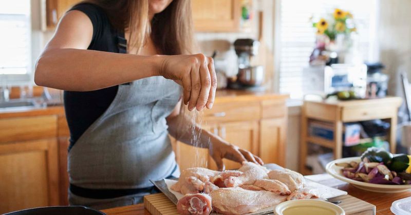 Don’t wash raw chicken before cooking because it spreads germs in the kitchen, warns CDC