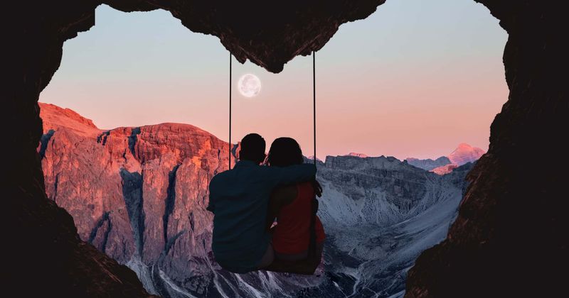 Couple slammed for sharing nerve-shredding photo showing them leaning out of moving train for 'wildest kiss'