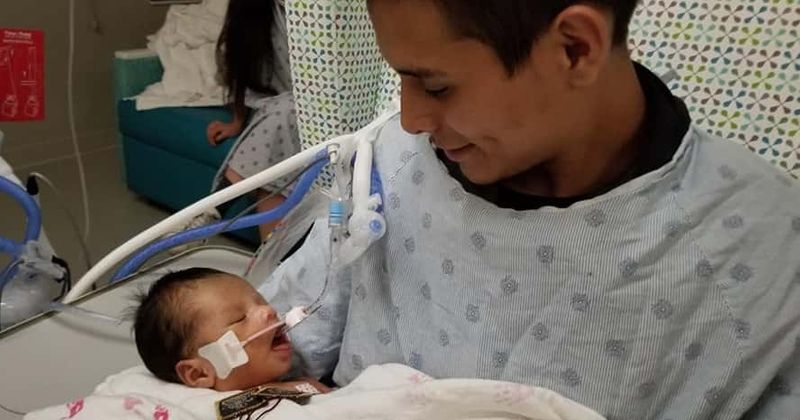 Baby cut out of mother's womb during 'womb raider' killing opens eyes for the first time while being held by dad