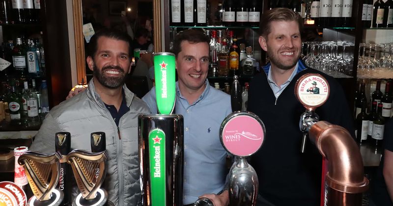 President Trump's sons pour Guinness pints on the house for locals at Irish village during D-Day European tour
