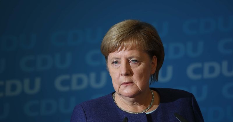 Angela Merkel shakes uncontrollably in public for the second time in two weeks, folds her arms visibly to stop the trembling