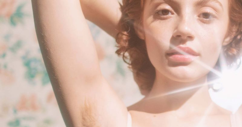 Women proudly flaunt pubic and underarm hair on the beach for razor brand's body hair positivity campaign
