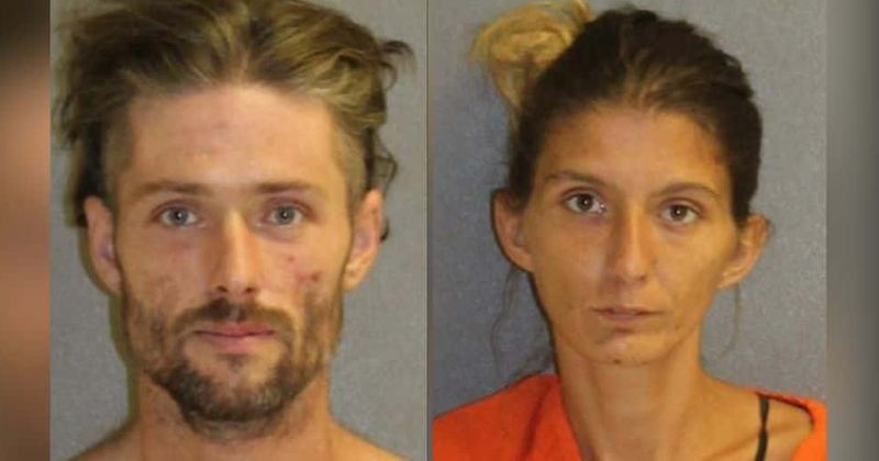 Florida couple caught injecting drugs while two-year-old daughter sat behind them in filthy, roach-infested car