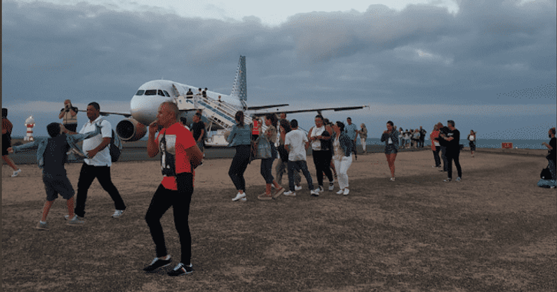 Terrified passengers evacuate plane after 11-year-old leaves note claiming there's a bomb and signs off as 'the terrorist'