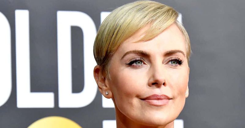 Charlize Theron admits that she has her share of 'bad days' and says her kids can be 'a--holes' too