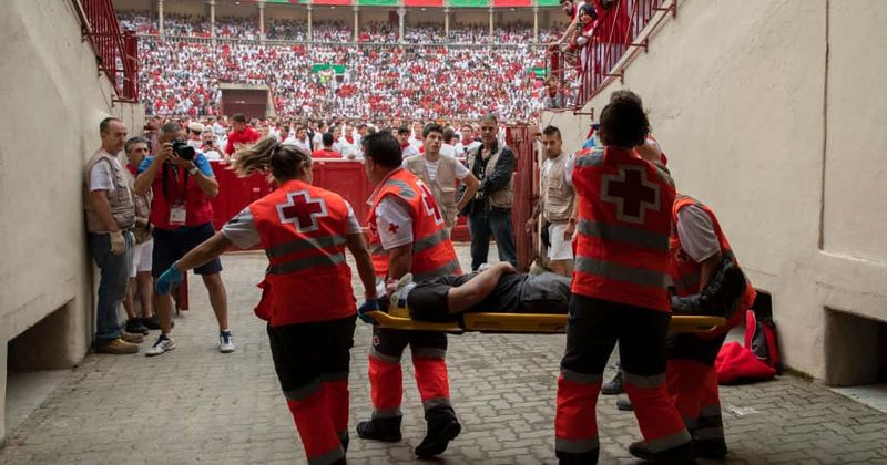 US tourist, 23, seriously injured after he was gored in the left leg during Pamplona's infamous bull festival