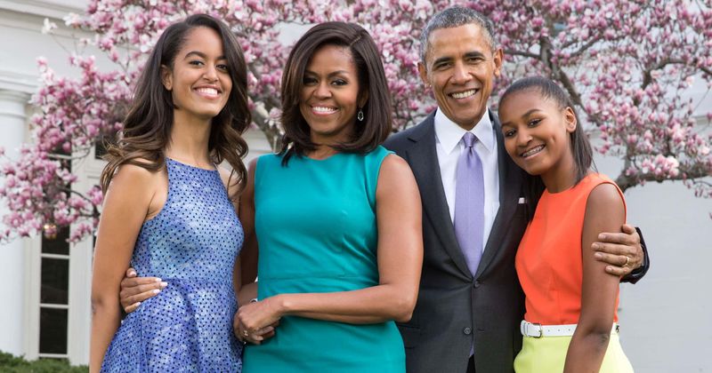 Malia and Sasha had their first kisses in White House and around 'a bunch of men with guns and earpieces', says Michelle Obama
