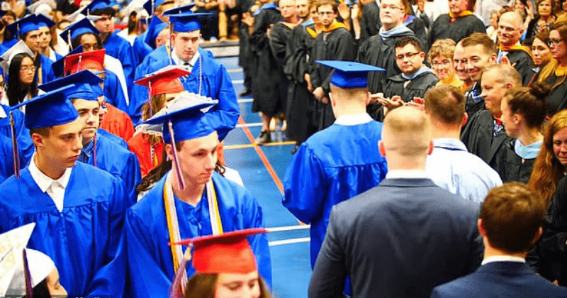 Emotional footage shows NY high school graduates give autistic student a 'silent standing ovation' as he is extremely sensitive to noise
