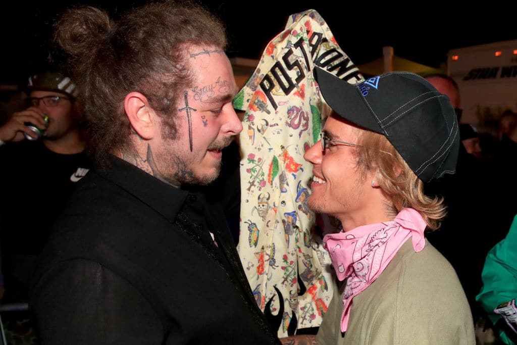 Post Malone and Justin Bieber speak backstage during 2018 Coachella Valley Music And Arts Festival Weekend 1 at the Empire Polo Field on April 14, 2018 in Indio, California. (Photo by Christopher Polk/Getty Images for Coachella)