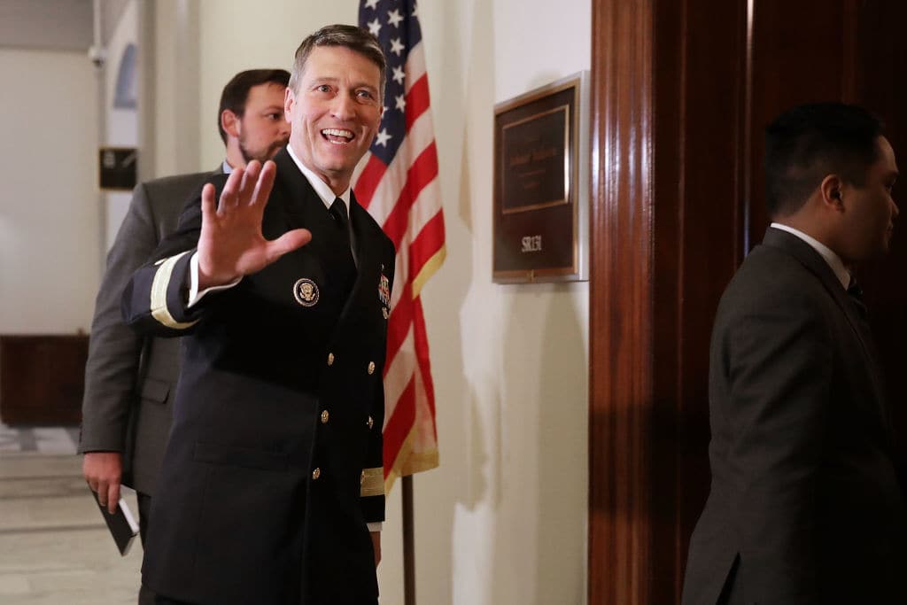 Physician to the President U.S. Navy Rear Admiral Ronny Jackson waves to journalists as he heads into a meeting with Senate Veterans Affairs Committee Chairman Johnny Isakson (R-GA) in the Russell Senate Office Building on Capitol Hill April 16, 2018 in Washington, DC. (Getty Images)