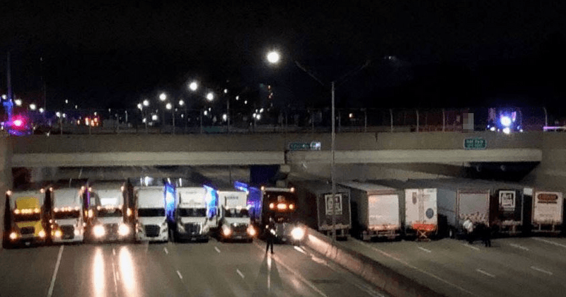Group of Good Samaritan truckers line up to make a safety net under a bridge after a man threatens suicide