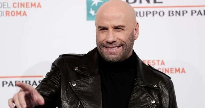 John Travolta is unrecognizable as he steps out in a Hawaiian shirt and creepy bowl cut hair