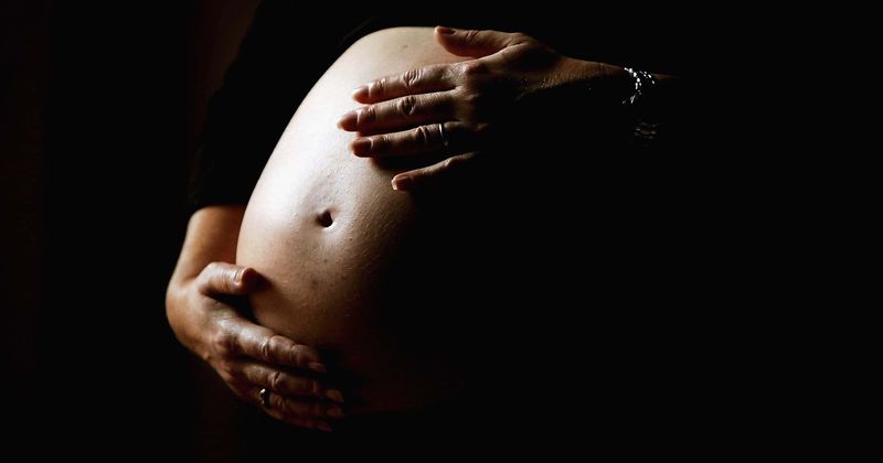 Does love have a heartbeat? Mother's decision to post pics of her stillborn baby online sees internet erupt with venom