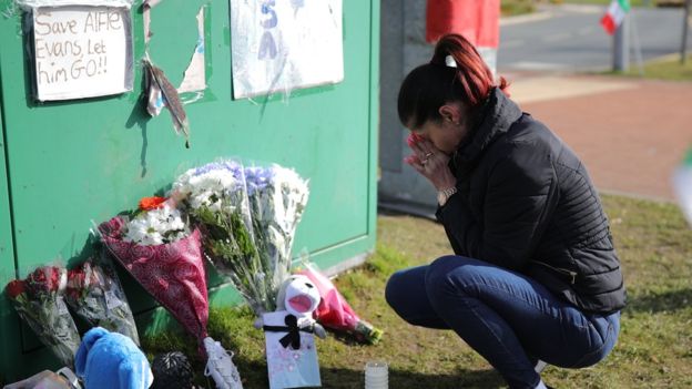 A woman grieves outside the Alder Hey children's hospital (Right Journalism)