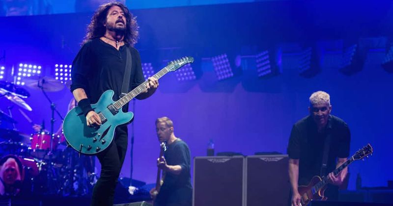 Foo Fighters bring out John Travolta on stage during a cover of a 'Grease' song