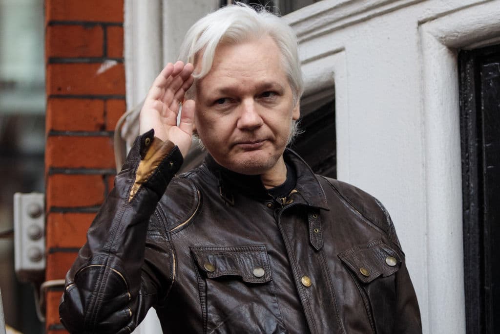 Julian Assange gestures as he speaks to the media from the balcony of the Embassy Of Ecuador on May 19, 2017 in London, England.