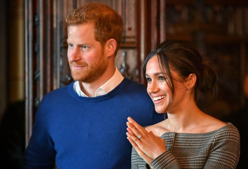 Prince Harry and Meghan Markle watch a performance by a Welsh choir in the banqueting hall during a visit to Cardiff Castle on January 18, 2018 in Cardiff, Wales. (Photo by Ben Birchall - WPA Pool / Getty Images)