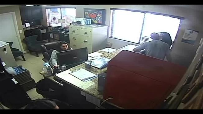 The victim's school explained one woman who was pregnant and seen in the footage was too scared to intervene in the child's beating as the officer was 'armed'. (Screengrab)