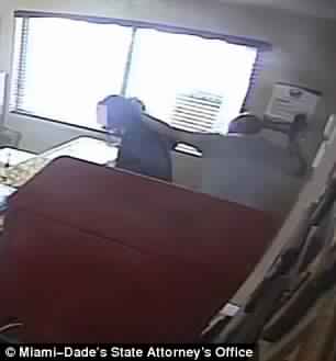The police officer can be seen whipping his daughter with a belt in the said footage. (Screengrab)
