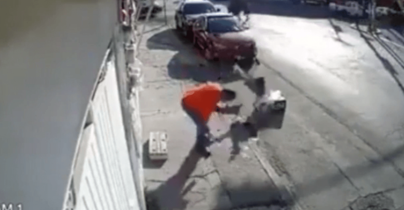 The girl is seen to be hurled to the floor in a sudden move. (Screenshot)