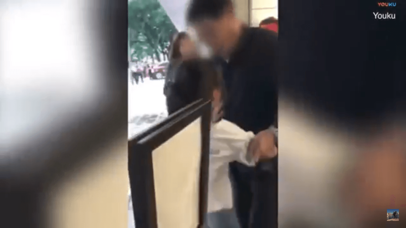 The man later violently dragged the child to the side. (Youtube)