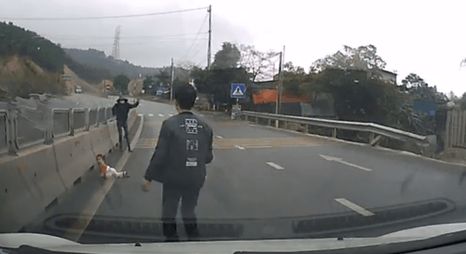 A baby crawls across the road in a clip dated to March 2018. (Source: Youtube.com)