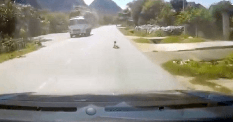 Shocking dashcam footage shows driver slamming on brakes after he sees baby crawling down middle of road