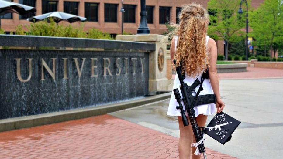 A recent Kent State University graduate’s pro-gun rights photo shoot has gone viral. (YouTube screengrab)