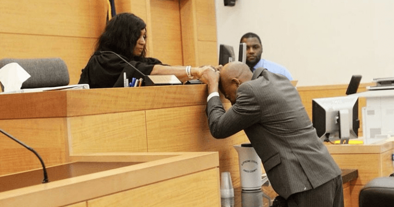 Touching moment man wrongly convicted of murder as 14-year-old weeps in front of the judge who exonerated him after 27 years