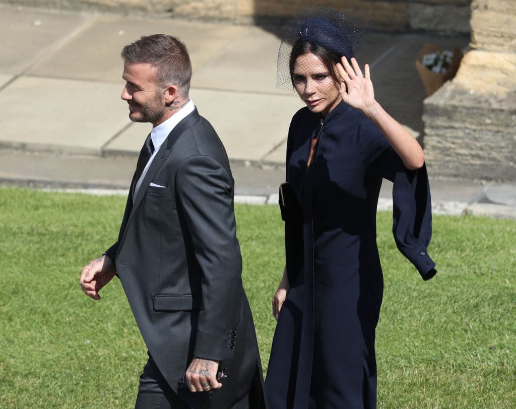 David and Victoria Beckham arrive at St George's Chapel, Windsor Castle for the wedding of Megan Markle and Prince Harry at St George's Chapel, Windsor Castle on May 19, 2018 (Photo by Andrew Milligan - WPA Pool/Getty Images)