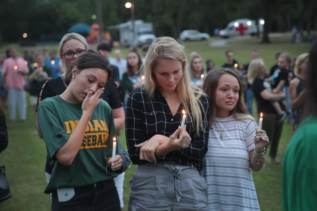 Residents attend a prayer vigil to remember the victims from the Santa Fe High School shooting at Walter Hall Park on May 20, 2018, in League City, Texas. (Photo by Scott Olson/Getty Images)