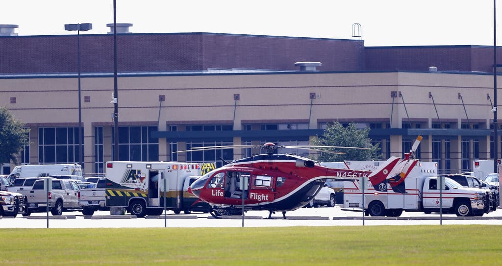 Emergency crews stage in the parking lot of Santa Fe High School where at least 10 students were killed on May 18, 2018, in Santa Fe, Texas. (Photo by Bob Levey/Getty Images)