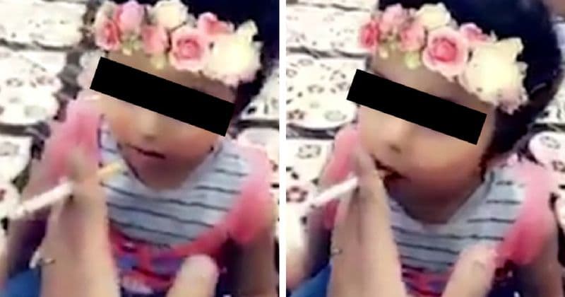 Father arrested after video footage of him teaching a young girl how to smoke goes viral
