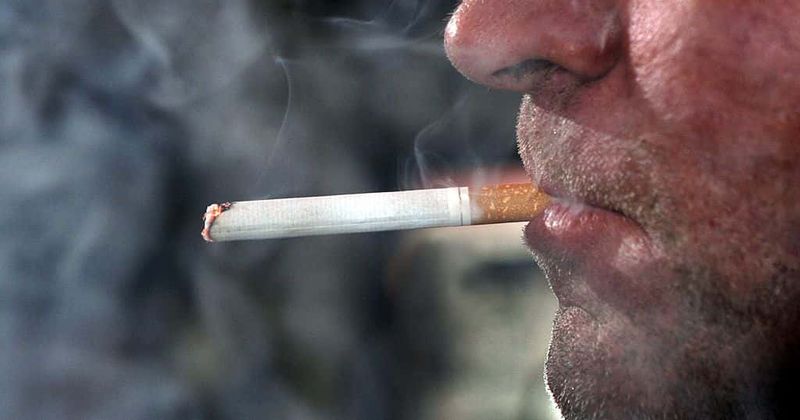 Father arrested after video footage of him teaching a young girl how to smoke goes viral