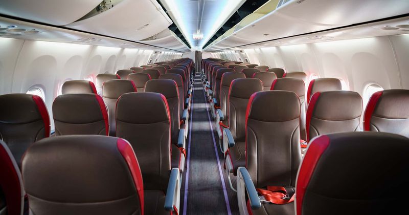 Woman escorted off flight after she hurls abuse at passengers and assaults crew with her Bible