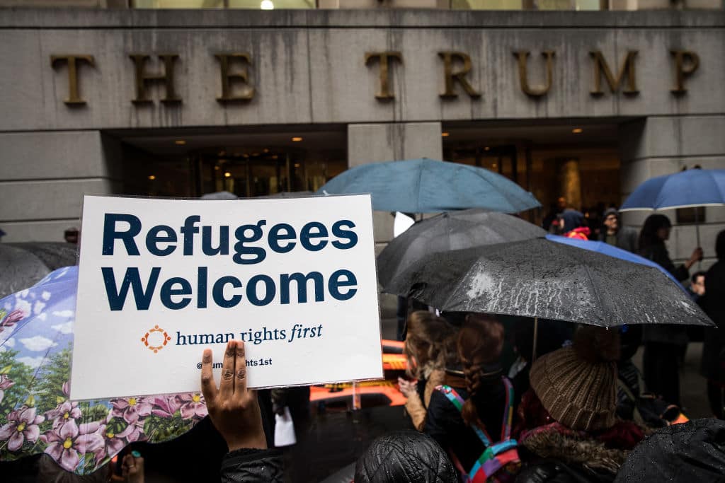 rotestors rally in front of the Trump Building on Wall Street during a protest against the Trump administration's proposed travel ban and refugee policies, March 28, 2017 in New York City. (Getty Images)