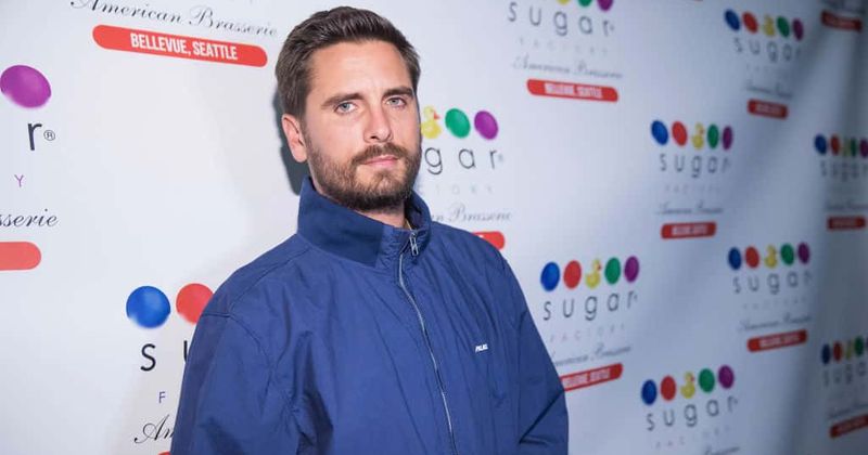 Scott Disick snuggles up to a blonde girl at Kanye West's Wyoming party while Sofia Richie chills in Malibu