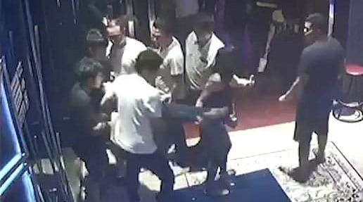 CCTV captured four men and a woman walking out with Gift (YouTube)