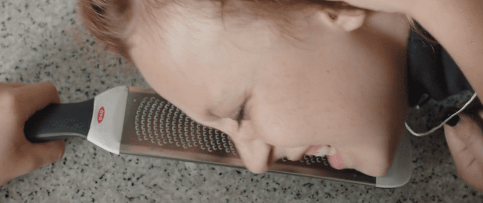 Emily imagining grating her sister, Julia's head.