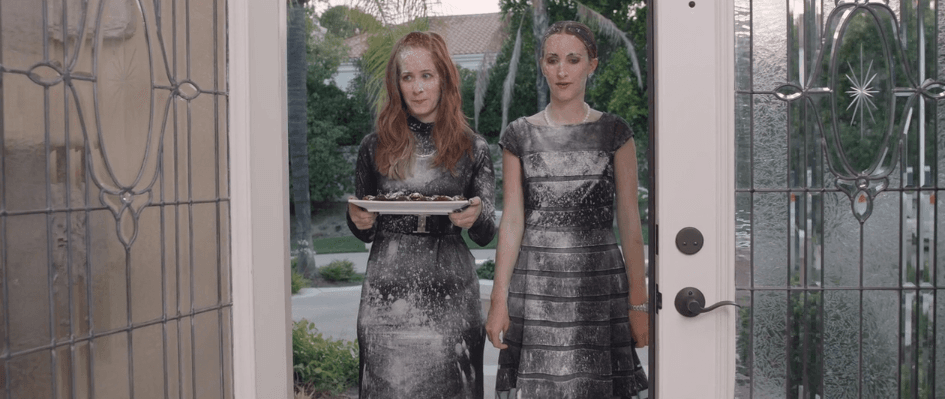 The sisters arriving at their mother's wake.