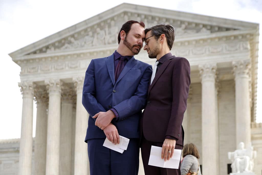 David Mullins (L) and Charlie Craig wait to speak to journalists after the U.S. Supreme Court hear the case Masterpiece Cakeshop v. Colorado Civil Rights Commission December 5, 2017 in Washington, DC. (Getty Images)