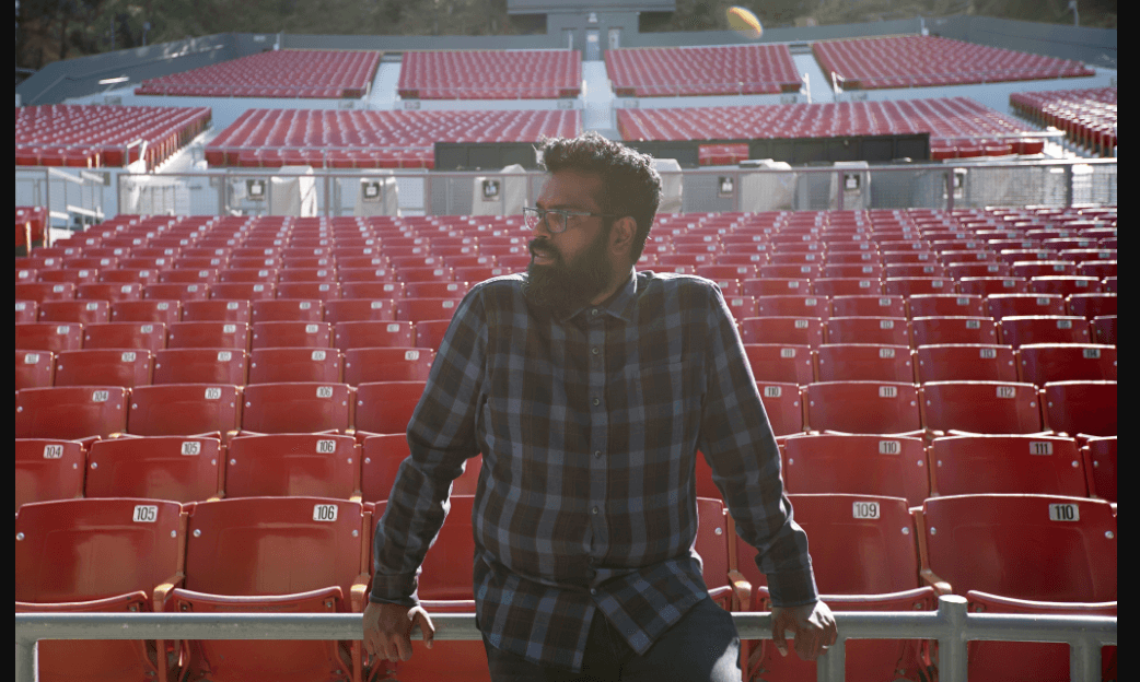 An image of Romesh Ranganathan in the 6,000-seat Greek Theater.