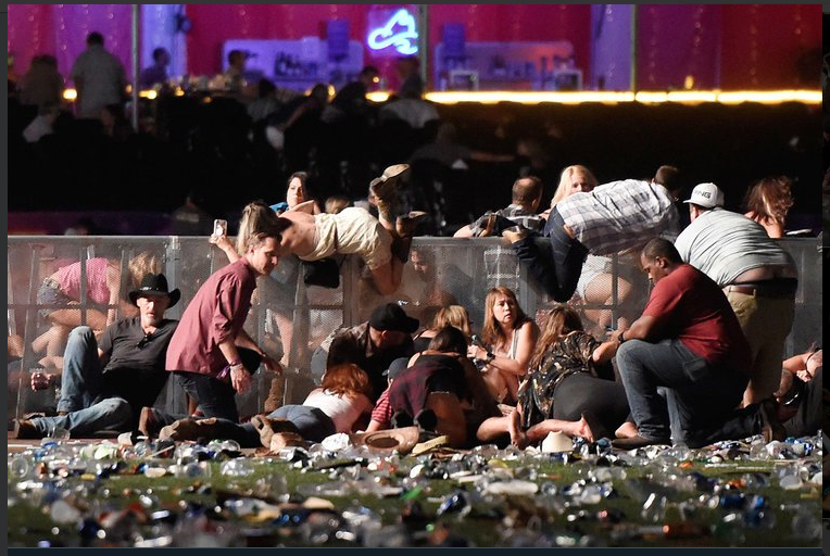 Concert-goers look for safety during the Las Vegas shooting in October. (Twitter)