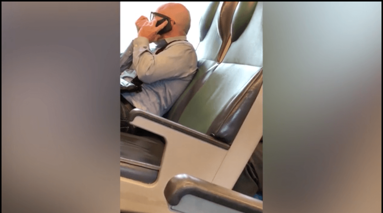 The man captured talking over the phone with someone who seemed to be a call center employee. (Twitter)